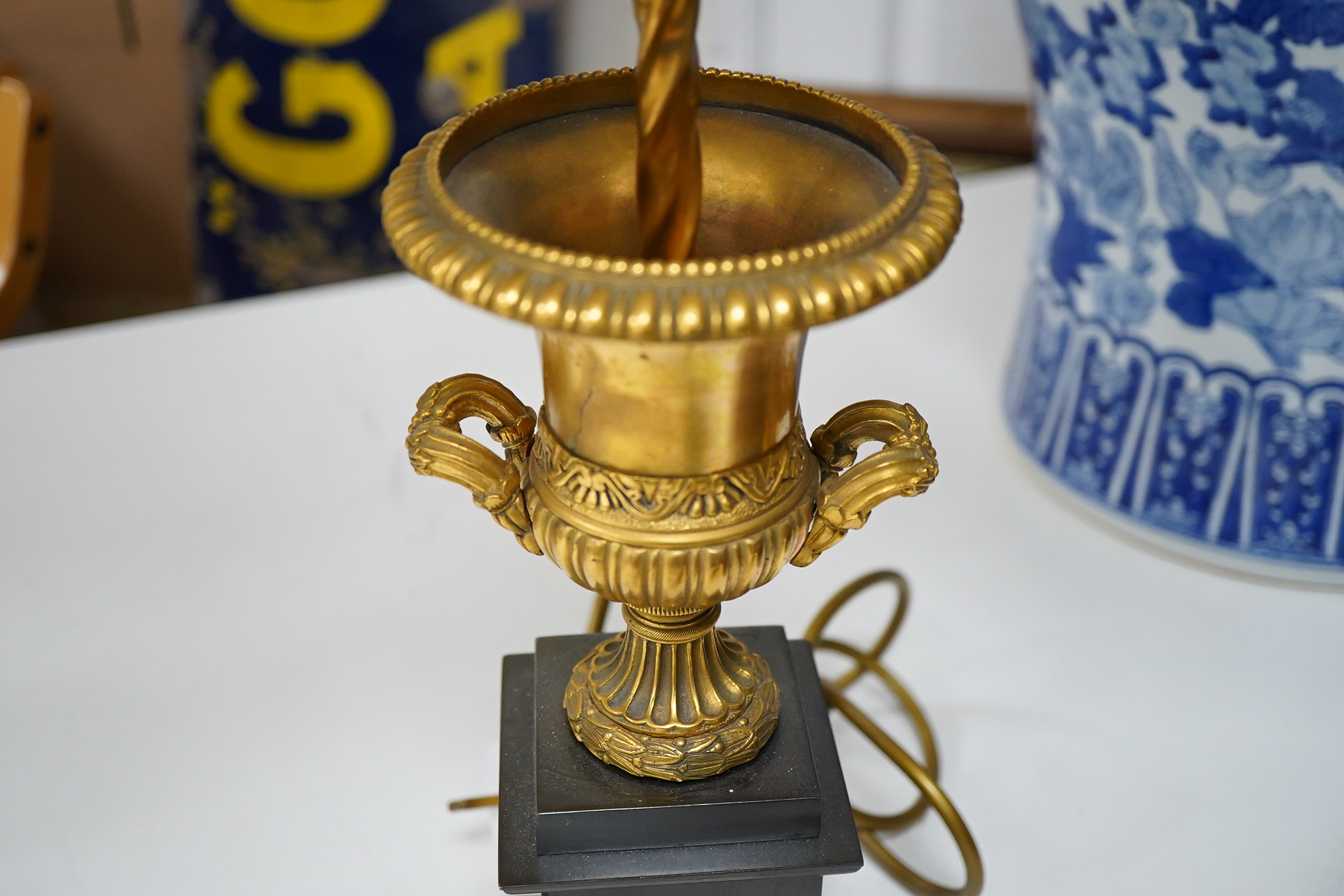 A pair of Empire style lamps with green shades